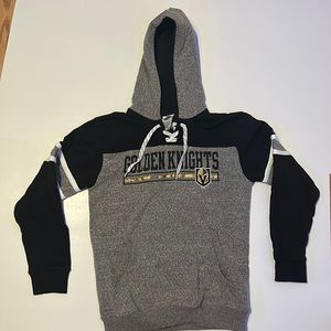 Golden knights sweatshirt with old fashion lacing.